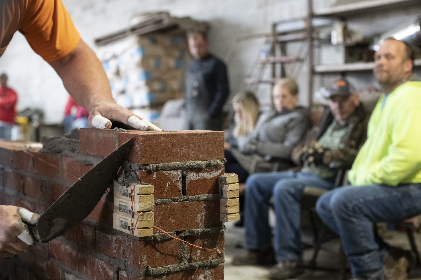 Payne lays bricks, hope for a victory in Bricklaying Contest